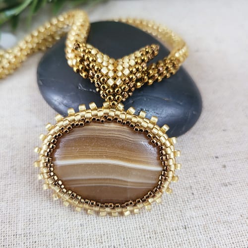 Handmade Jewellery & Stone Library Brown Banded Agate Oval Pendant On Gold Seed Bead Rope 6 Scaled